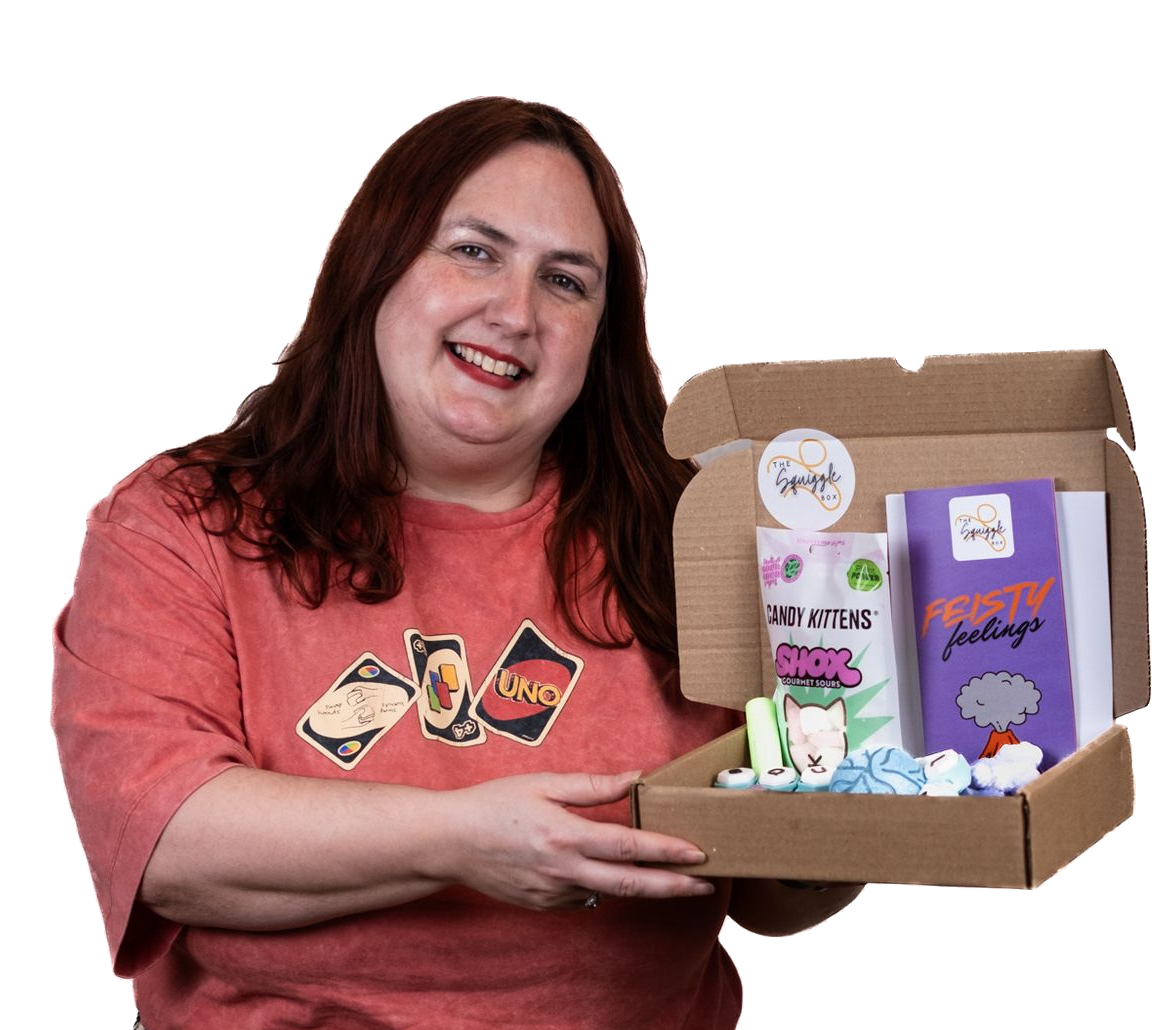 Emma Bronze, Chief Squiggler, holding an open Squiggle Box