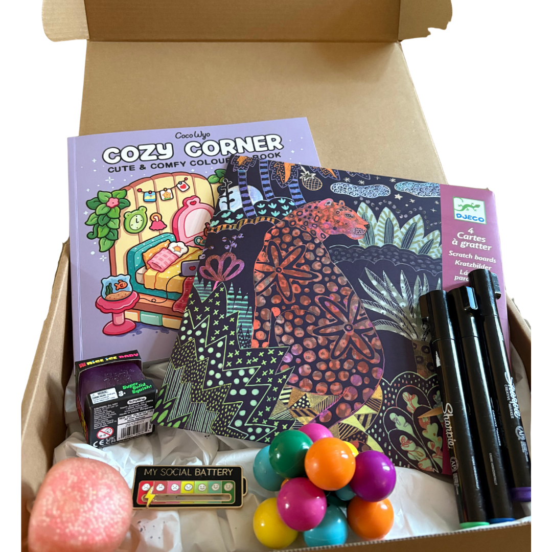 The Squiggle Box mockup showing colorful subscription box with mental health and wellness items